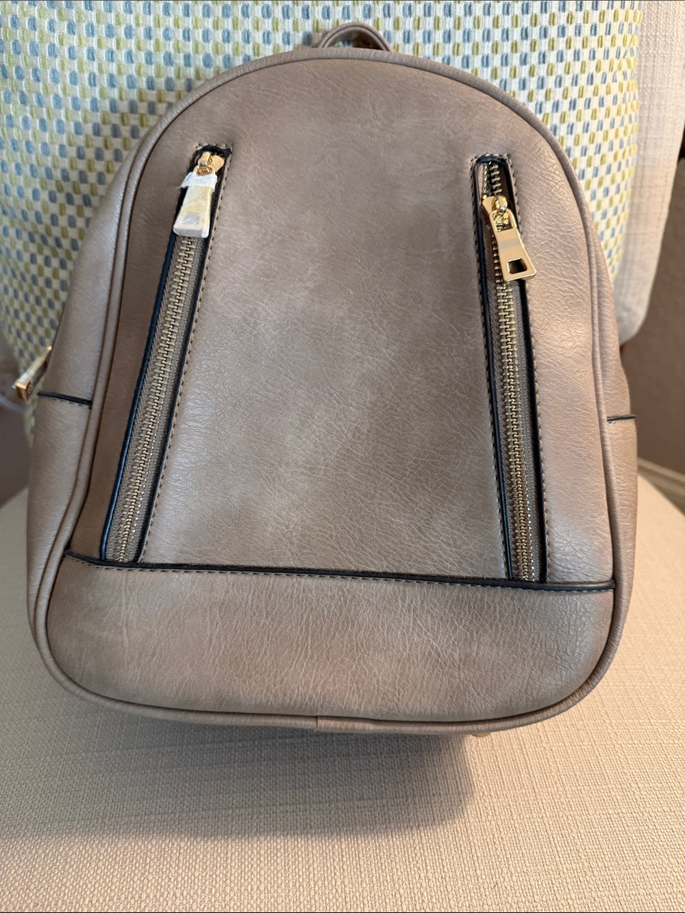 Mini Isabelle Taupe Backpack. Gold Hardware with Leopard Like Print Inside.